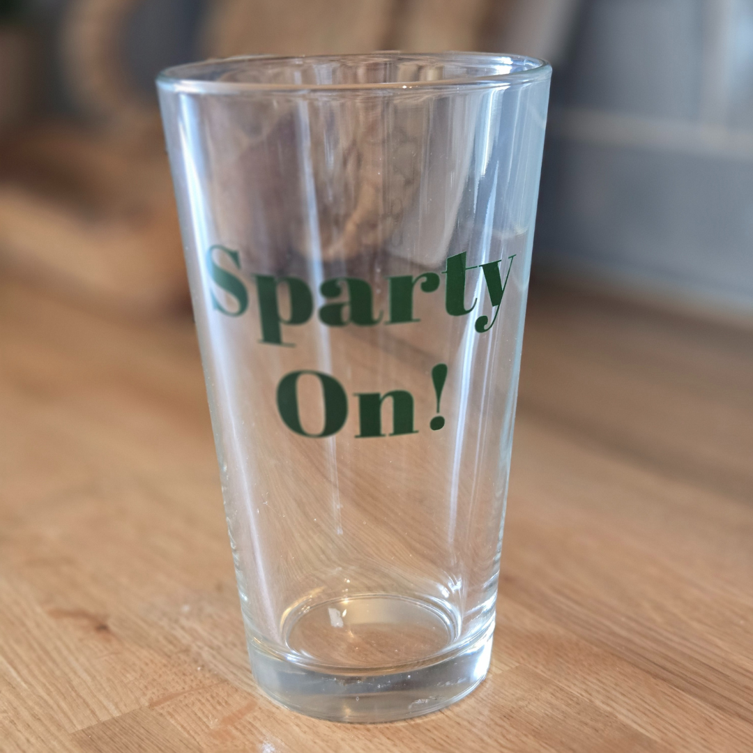 Michigan State University pint glass that says Sparty On!